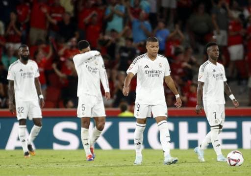 (From L) Real Madrid's German defender #22 Antonio Ruediger, Real Madrid's English midfielder #05 Jude Bellingham, Real Madrid's French forward #09 Kylian Mbappe and Real Madrid's Brazilian forward #07 Vinicius Junior react during the Spanish league football match between RCD Mallorca and Real Madrid CF at the Mallorca Son Moix stadium in Palma de Mallorca on August 18, 2024. (Photo by JAIME REINA / AFP)